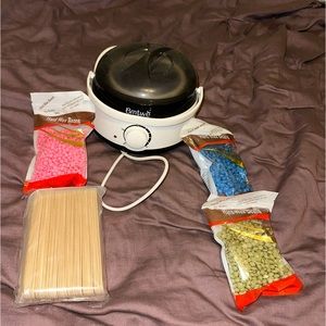 Wax warmer with 3 wax packets and 1 packet of sticks